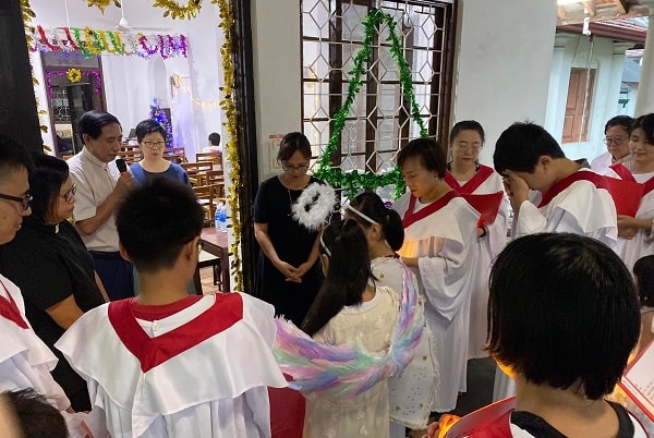 Praying Before Carol Service.